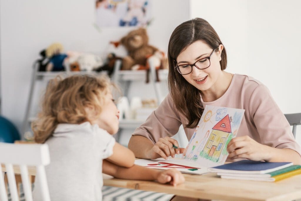 A Professional Therapist Having a Meeting with Kid