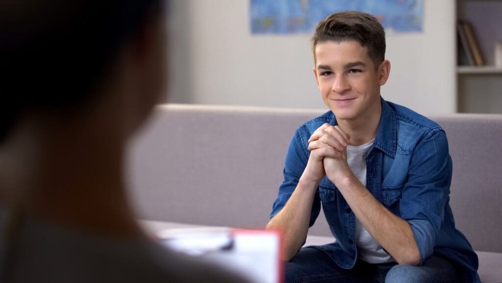 A Professional Therapist Having a Meeting with Teenage Boy