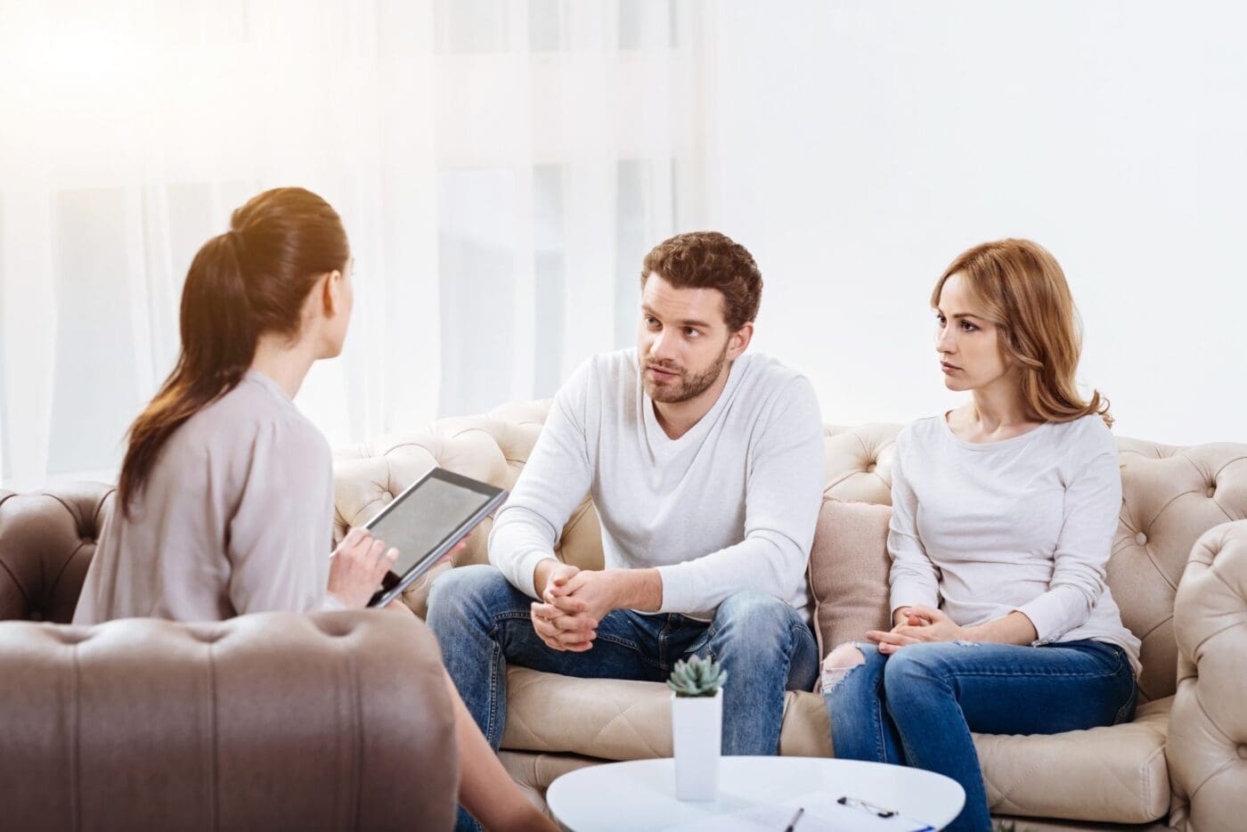 Cheerless Young Parents Visiting a Psychologist